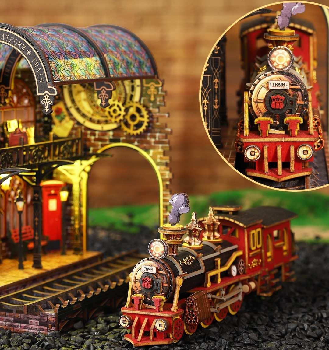 Vintage-style miniature toy train set with detailed station and close-up of train engine.