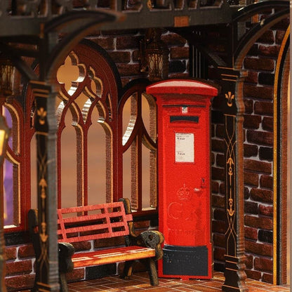 miniature Red mailbox and bench in a gothic-style room with brick walls.