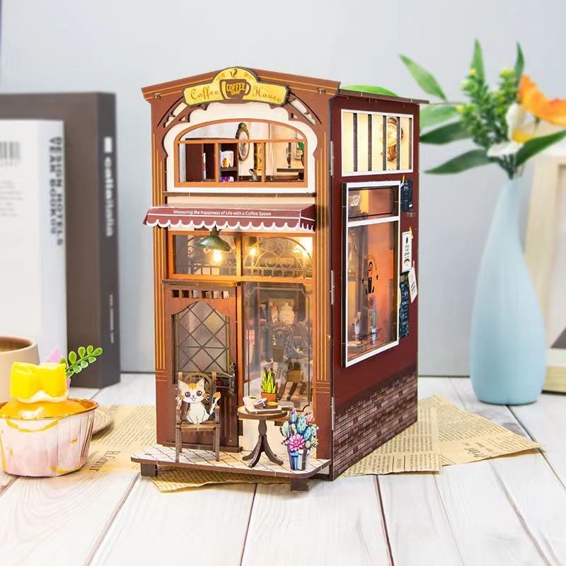 Coffee Shop DIY Book Nook Kit, A charming cafe themed miniature puzzle crafts, perfect for DIY crafting enthusiasts and dollhouse collectors alike. Ideal for bookshelf decor of gift for coffee lovers, right angle view in daylight