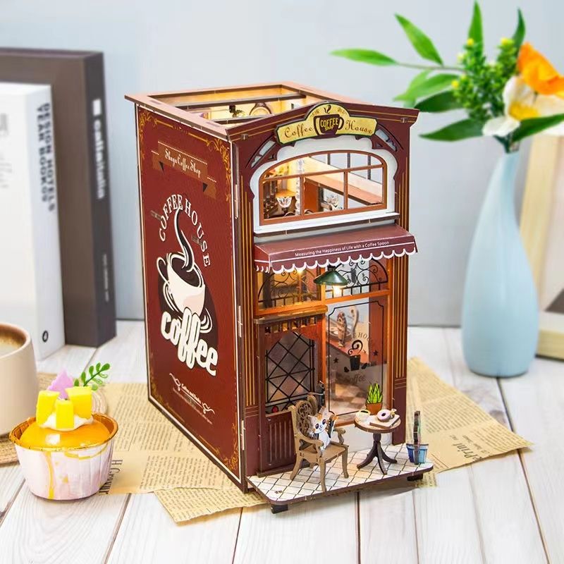 Coffee Shop DIY Book Nook Kit, A charming cafe themed miniature puzzle crafts, perfect for DIY crafting enthusiasts and dollhouse collectors alike. Ideal for bookshelf decor of gift for coffee lovers, left angle view in daylight