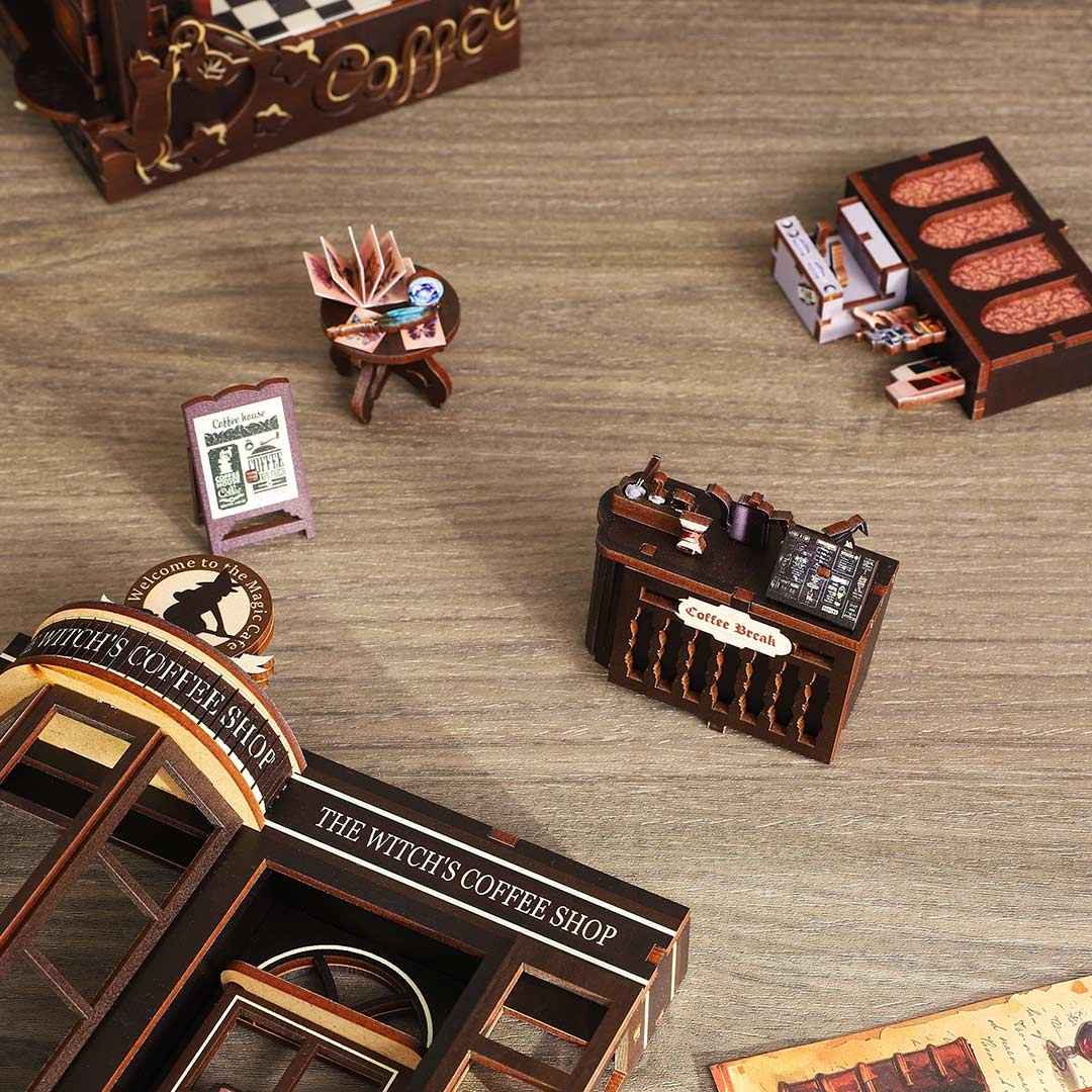 image displaying the miniature furniture of Magic Coffee Shop Book Nook are putting together