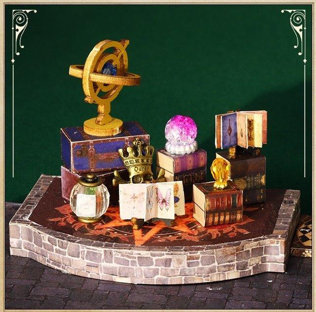 Magic Treasure House DIY Dollhouse Kit featuring a detailed miniature fantasy scene with intricate furniture, colorful decorations, and hidden treasures; designed for crafting enthusiasts to assemble and display as a magical, whimsical addition to any space.