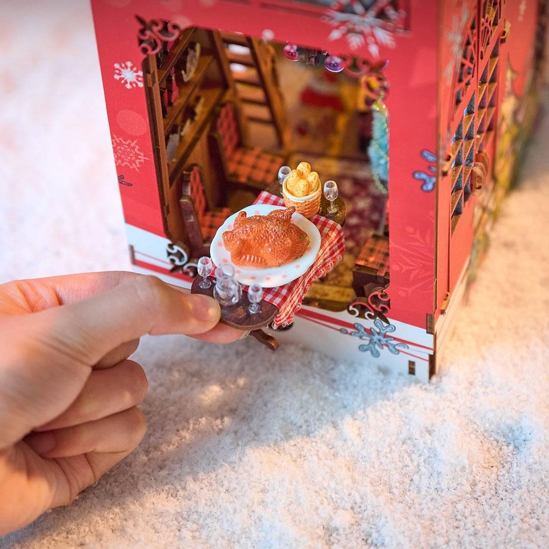 Merry Christmas DIY Book Nook Kit with enchanting miniature scenes, premium quality materials, and an easy 4-hour assembly. Perfect for shelf decor or gifting