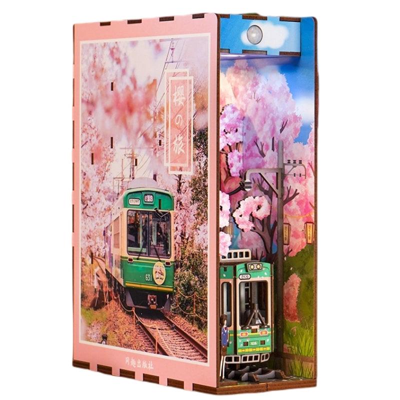Japanese Sakura Densya DIY Book Nook Kit, A charming miniature 3d wooden puzzles the captures the essence of springtime in Japan, perfect for bookshelf decor or a delightful gift for Japanese culture lovers.